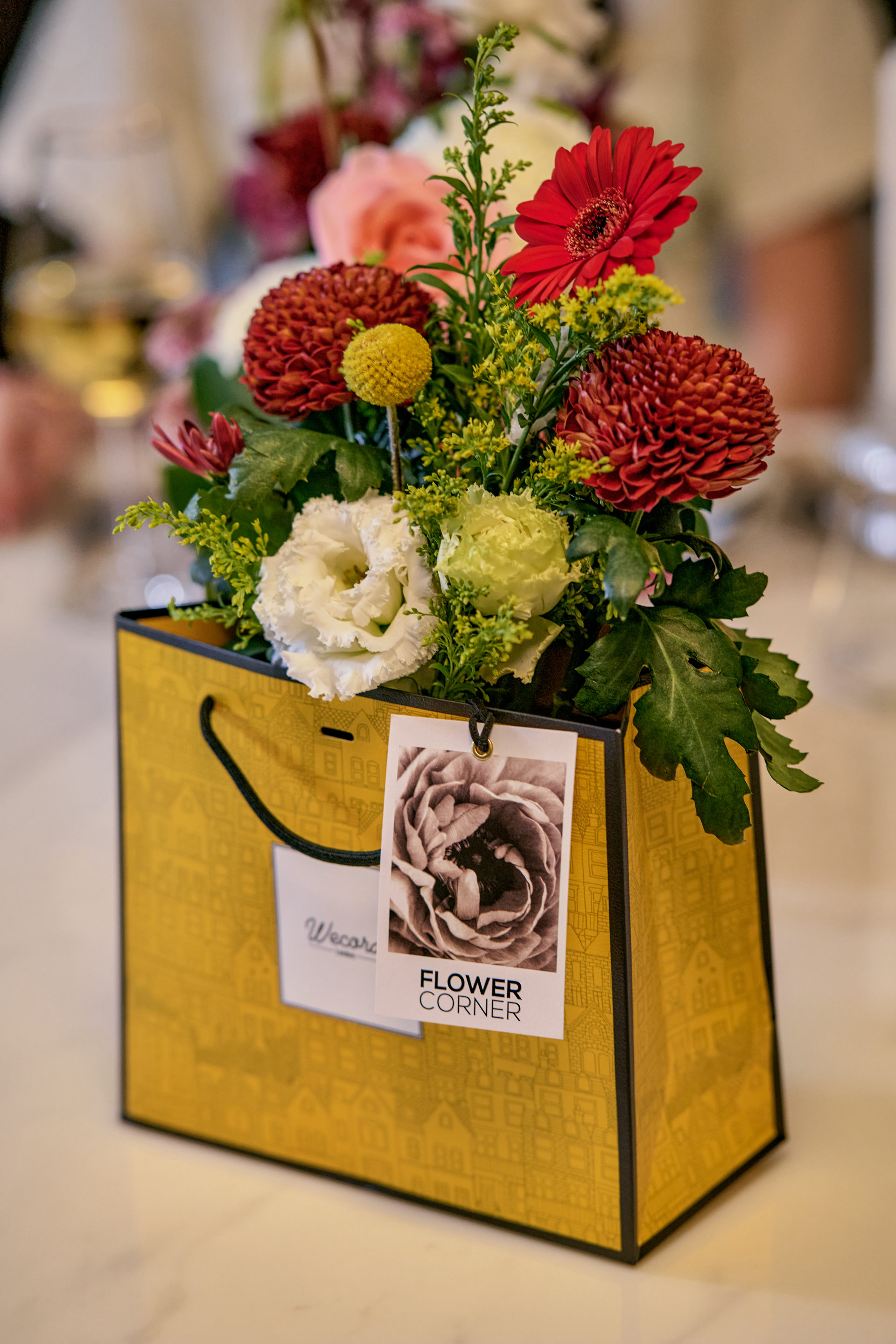 Signature yellow Flower Corner gift bag with fresh flowers at a Dubai celebration — photo 41