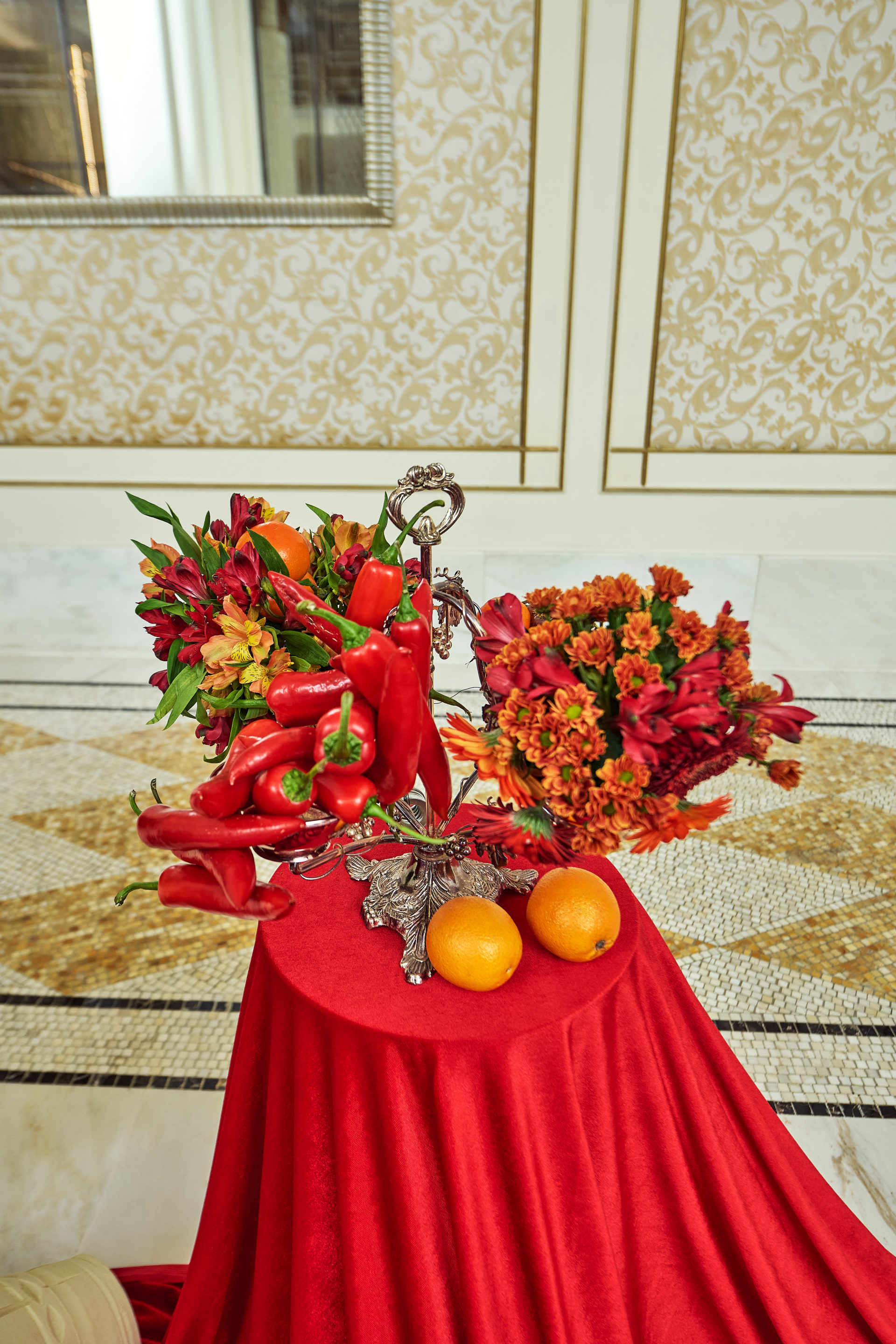 Red drapery, grapes, citrus and floral installations at a Dubai gala event, by Flower Corner — photo 67