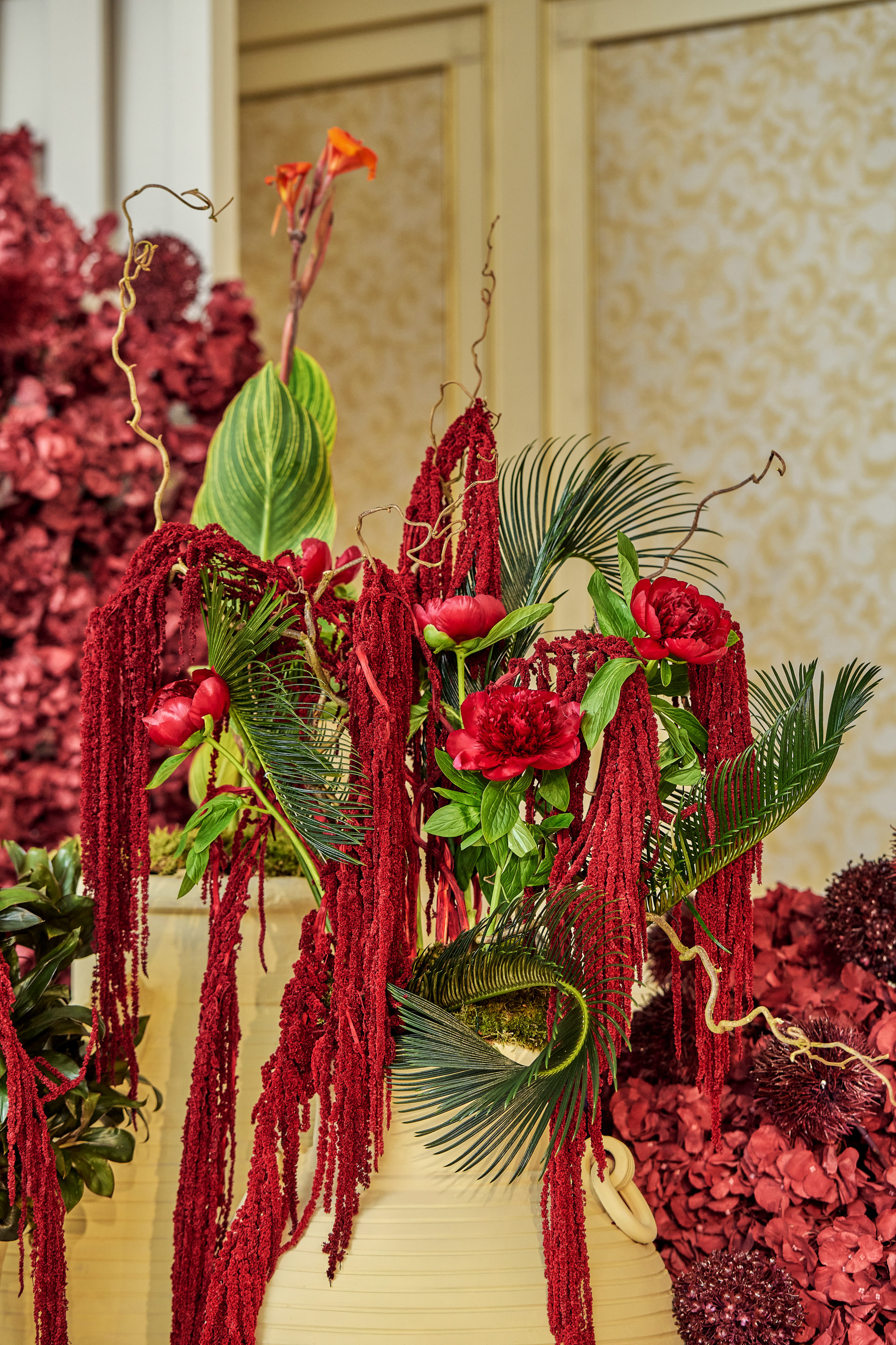 Red drapery, grapes, citrus and floral installations at a Dubai gala event, by Flower Corner — photo 156
