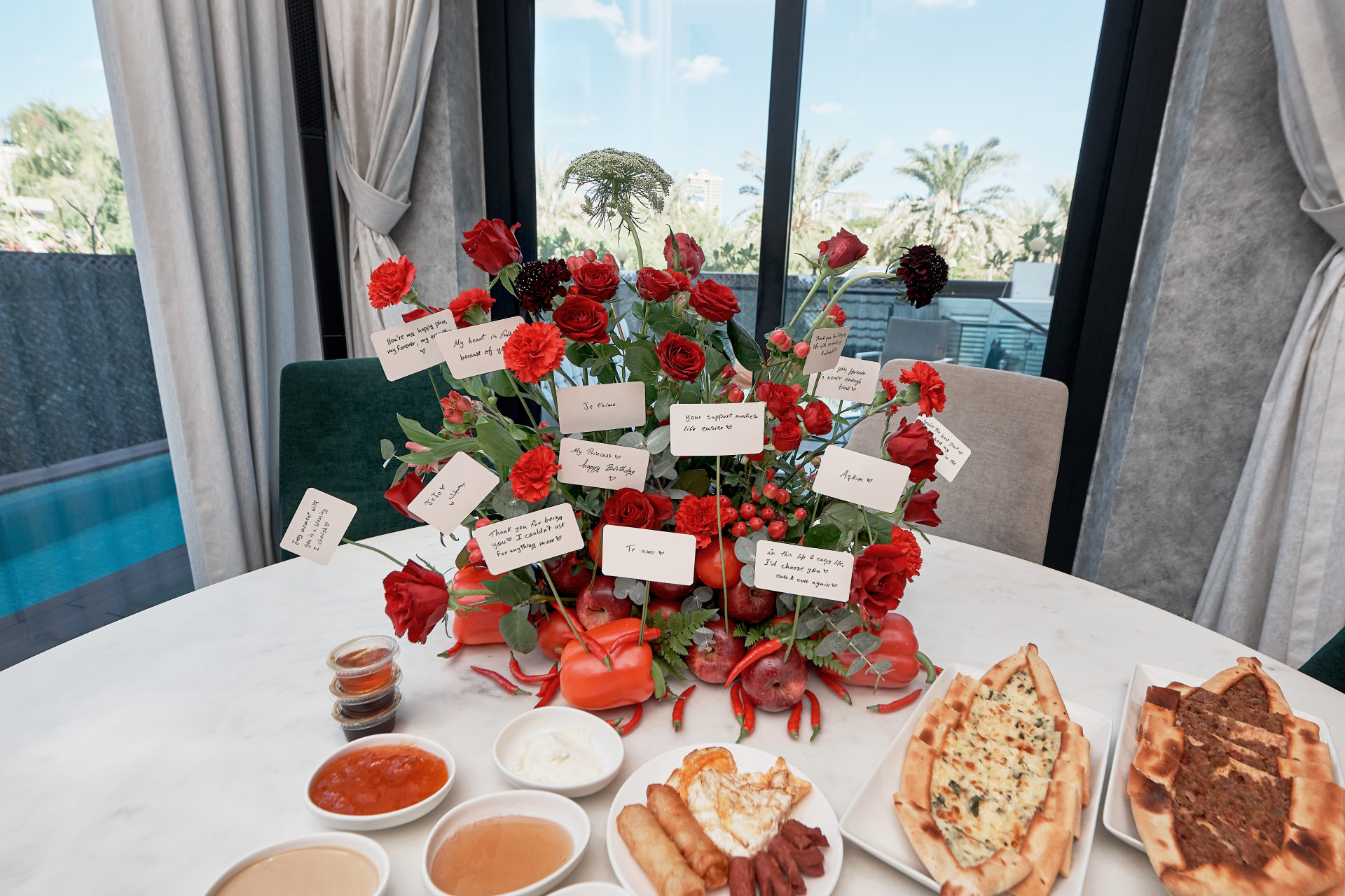 Red roses and celebration florals at a Dubai event, by Flower Corner — photo 320