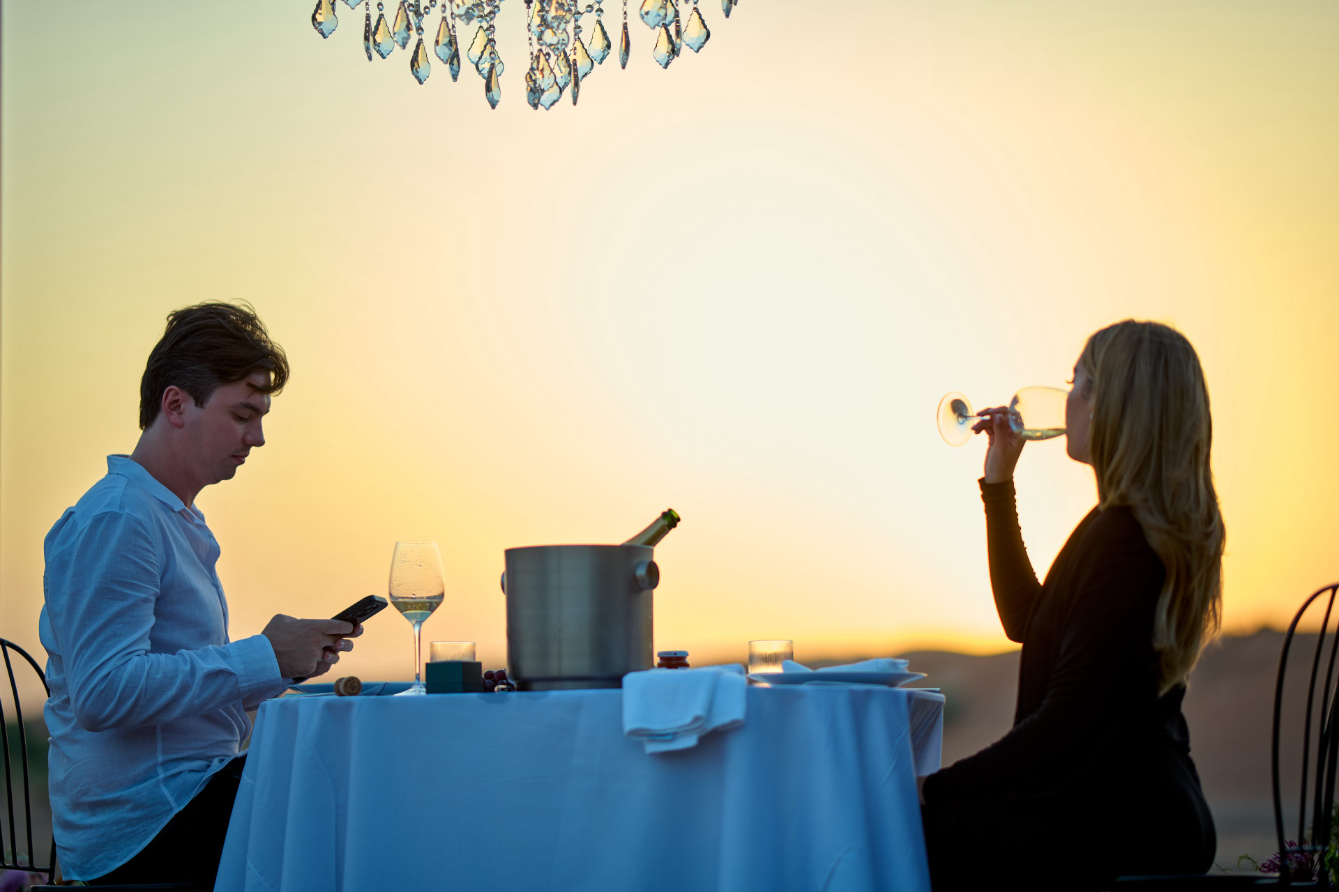 Floral circle, candles and chandelier styling for a desert proposal near Dubai, by Flower Corner — photo 590