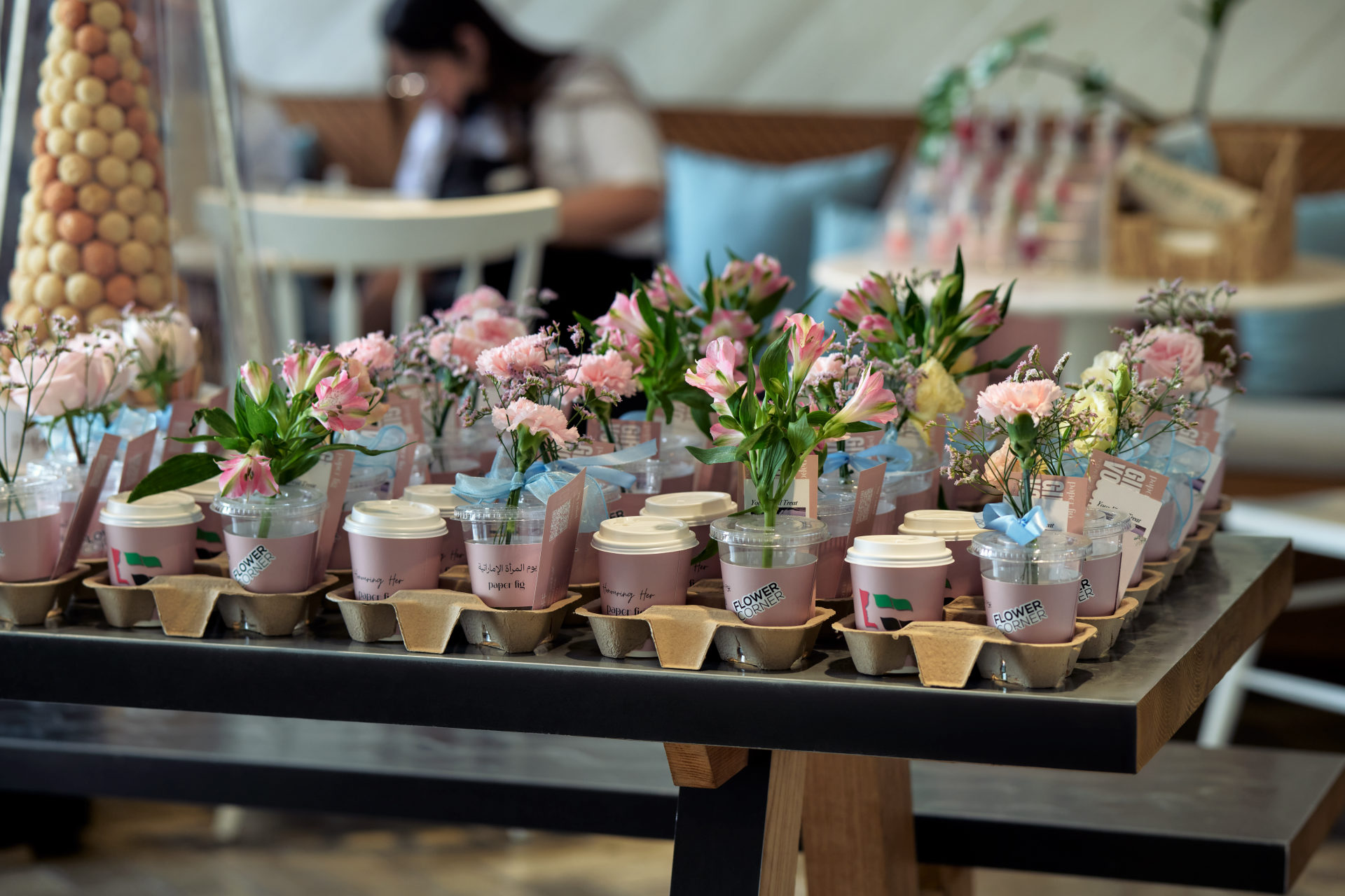 Flower Corner branded flower bar and guest giveaways at a Dubai brand activation — photo 281