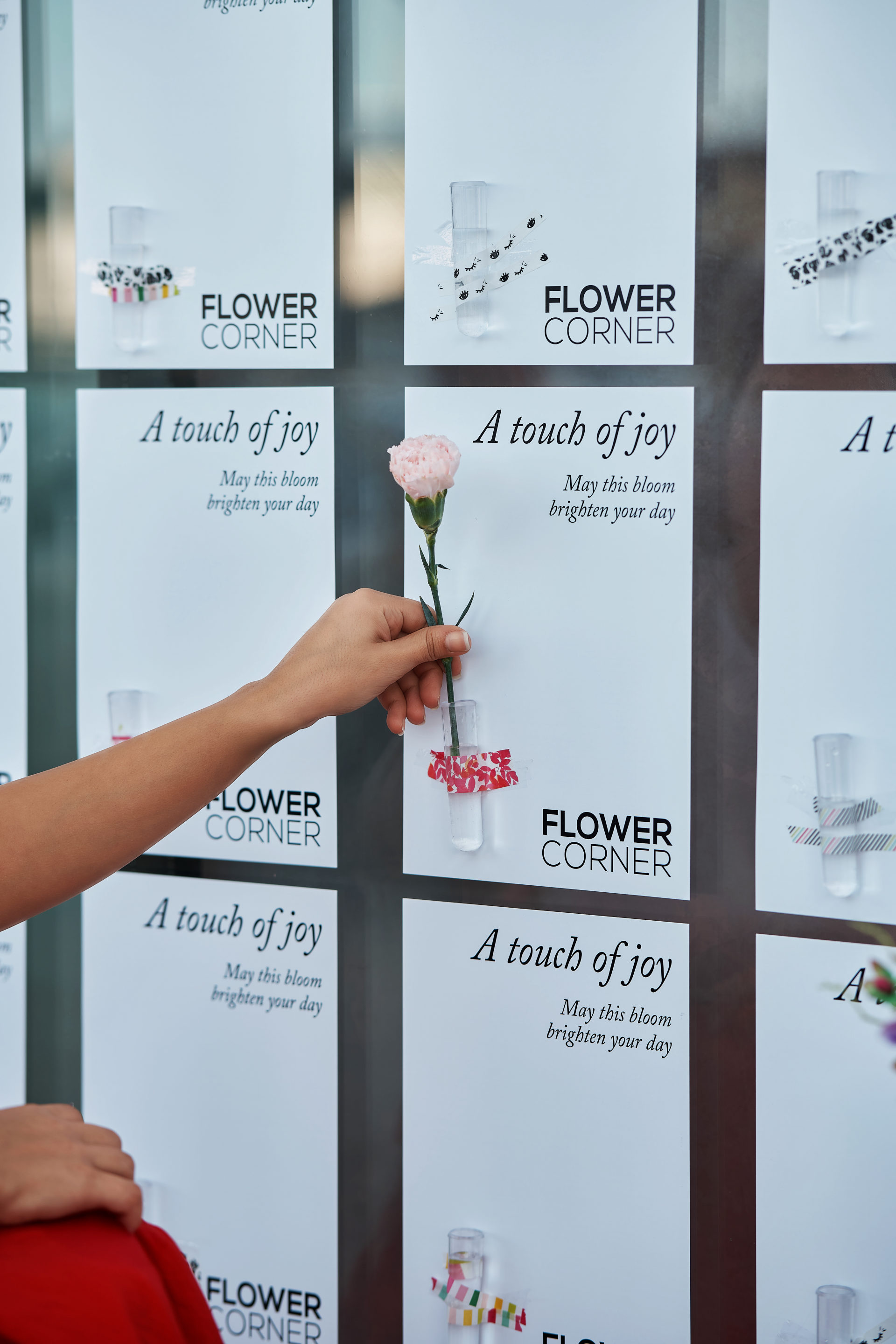 Flower Corner branded flower bar and guest giveaways at a Dubai brand activation — photo 376
