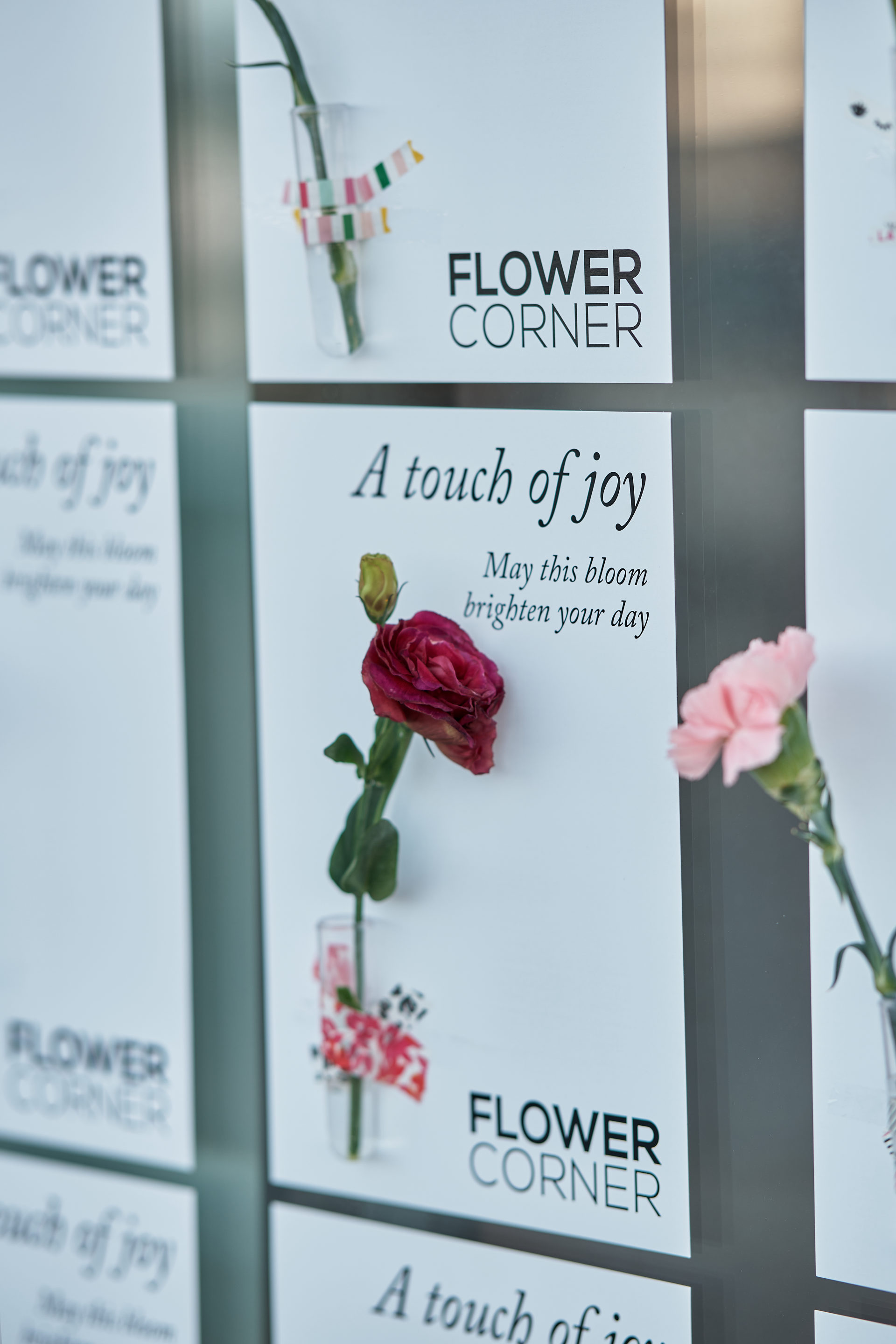 Flower Corner branded flower bar and guest giveaways at a Dubai brand activation — photo 389