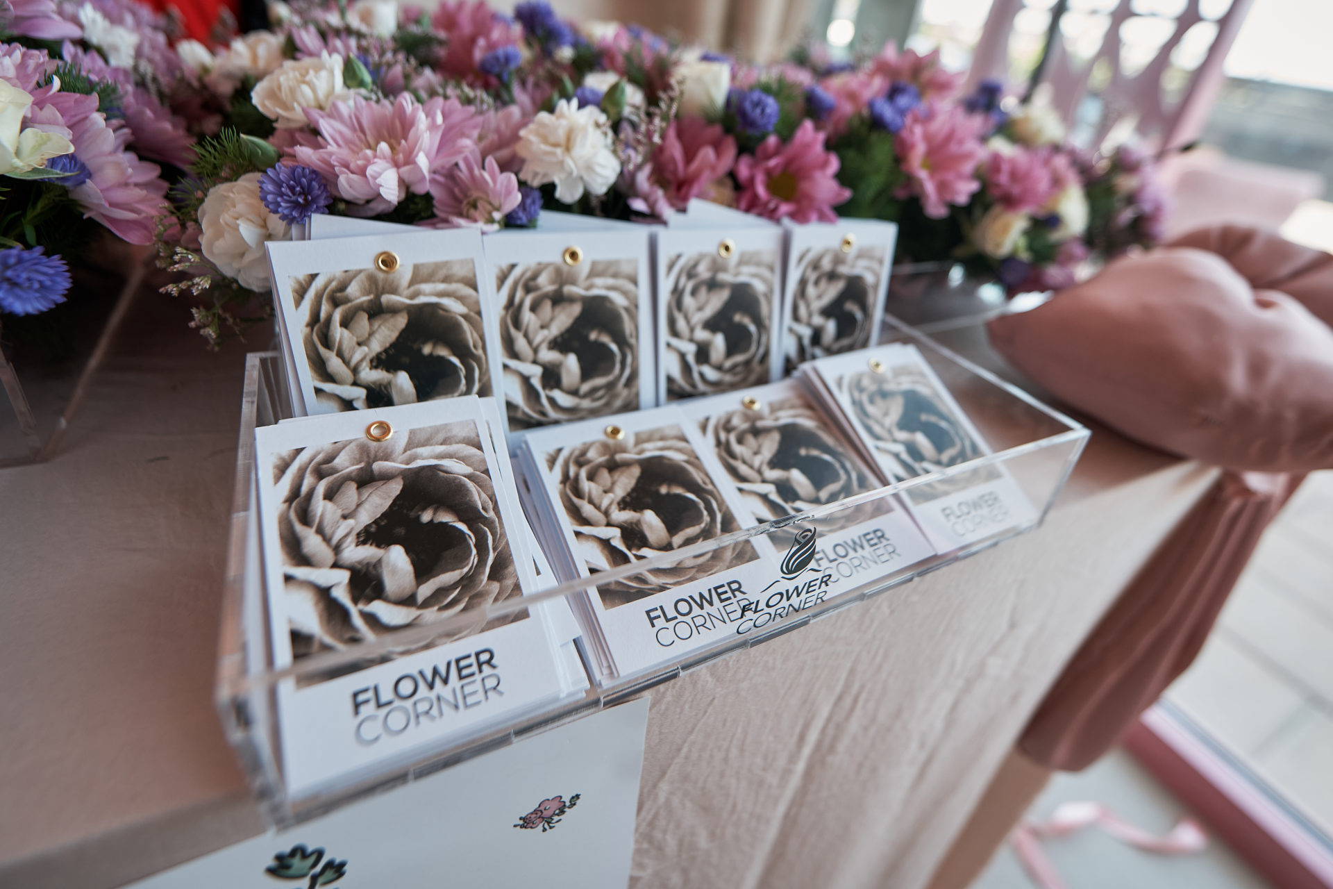 Flower Corner branded flower bar and guest giveaways at a Dubai brand activation — photo 394
