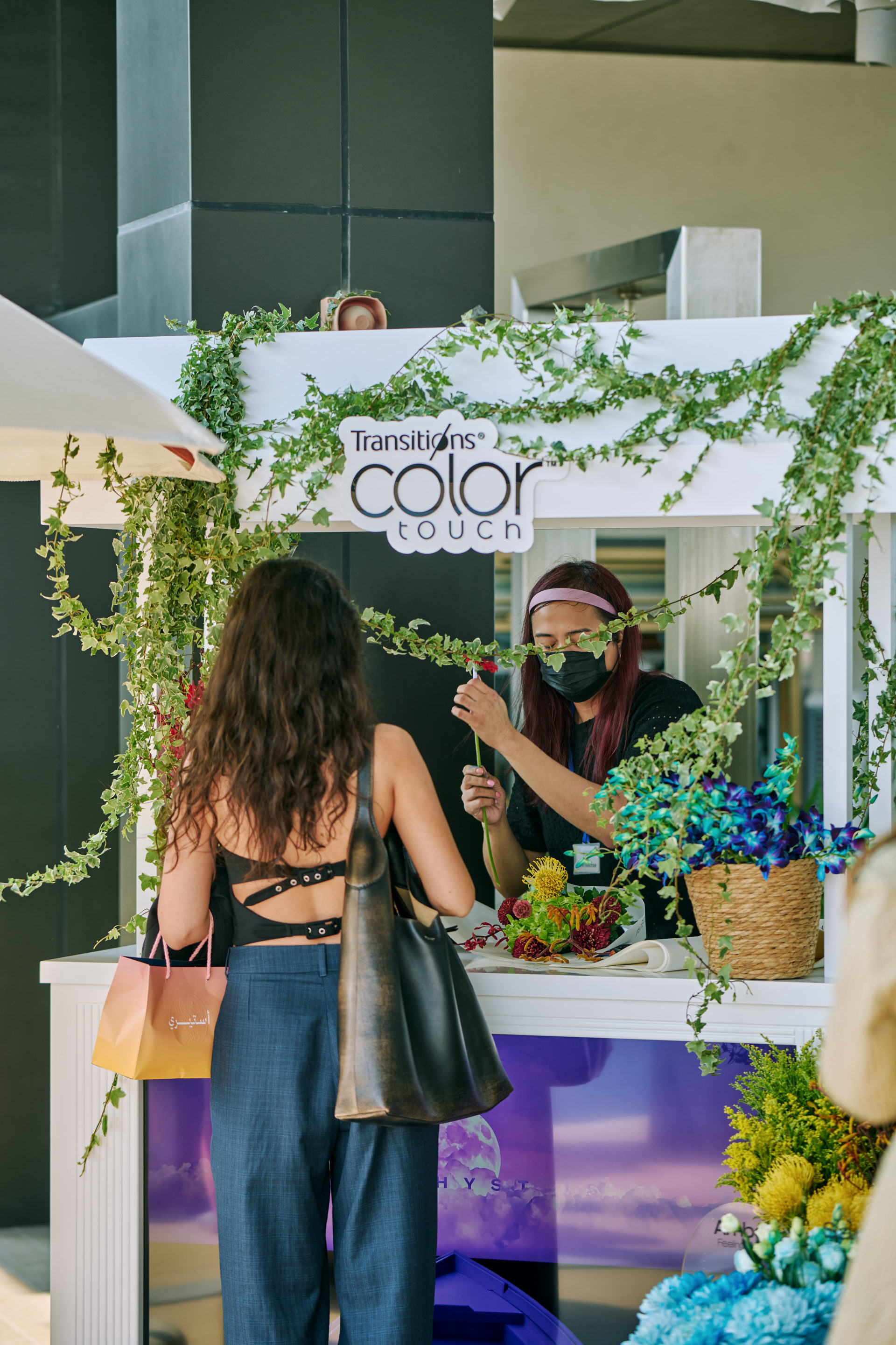 Flower Corner flower cart serving guests at a Dubai outdoor brand event — photo 769