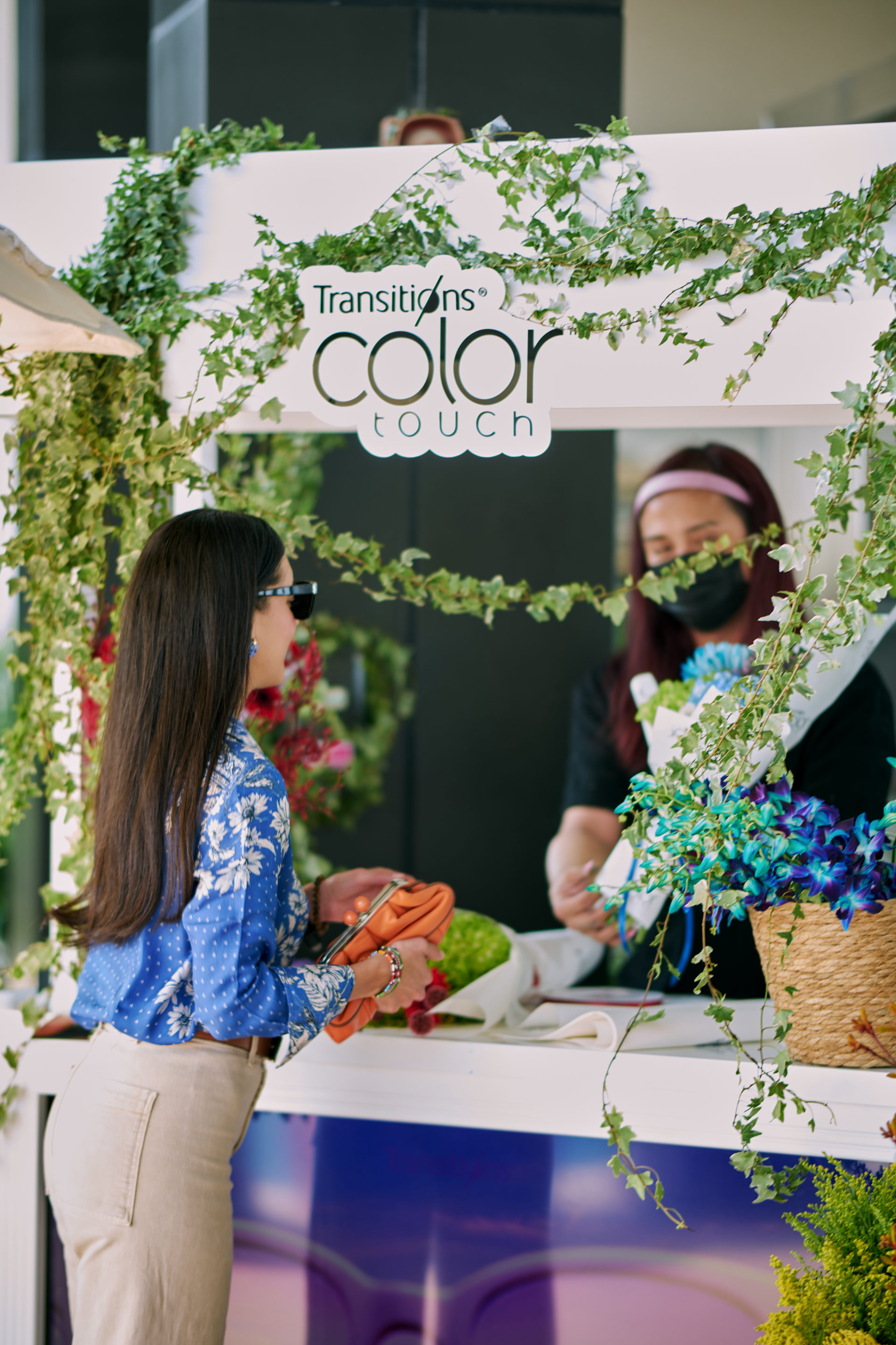 Flower Corner flower cart serving guests at a Dubai outdoor brand event — photo 873