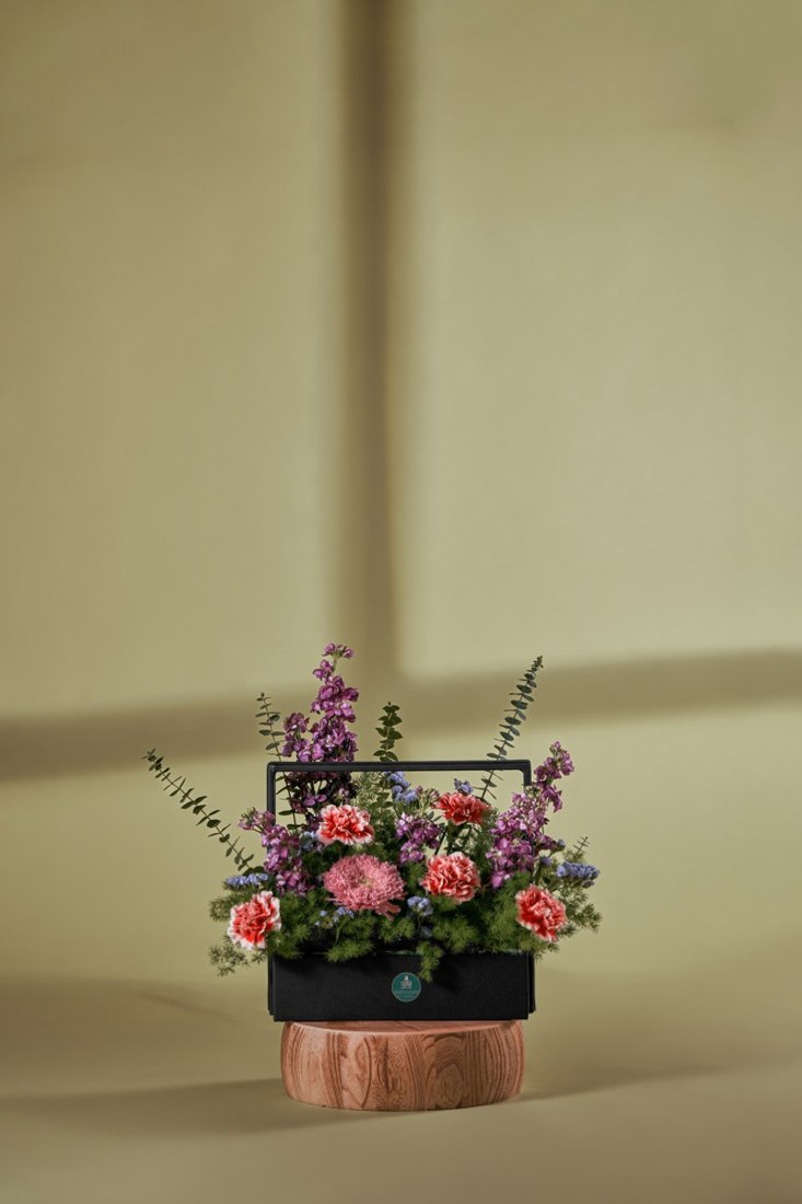 Coral Carnation & Purple Stock Garden Basket — Studio Series arrangement by Flower Corner, Sharjah
